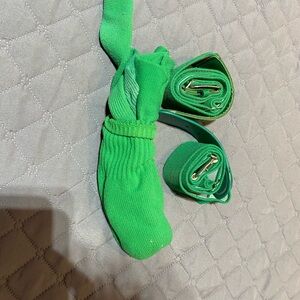 green baseball socks and 2 baseball belts